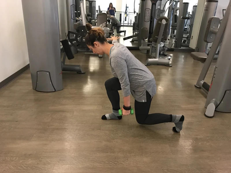 A patient working through a strengthening exercise in the clinic gym