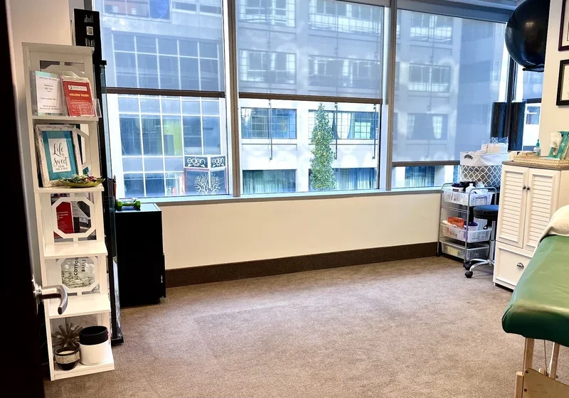 A treatment room at the clinic, with corner windows looking out over downtown Washington, DC